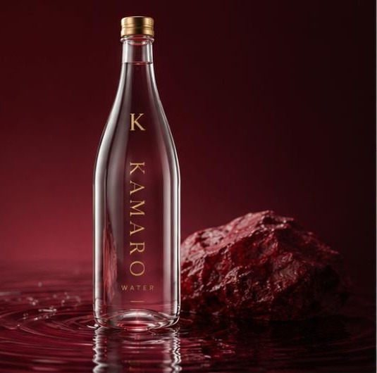 Kamaro Water bottle standing in mineral-red water